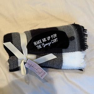 Travel blanket and eye mask set.